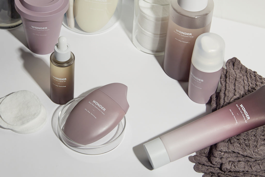 A collection of six Haruharu WONDER skincare products in colorful, minimalist packaging arranged on a white surface.