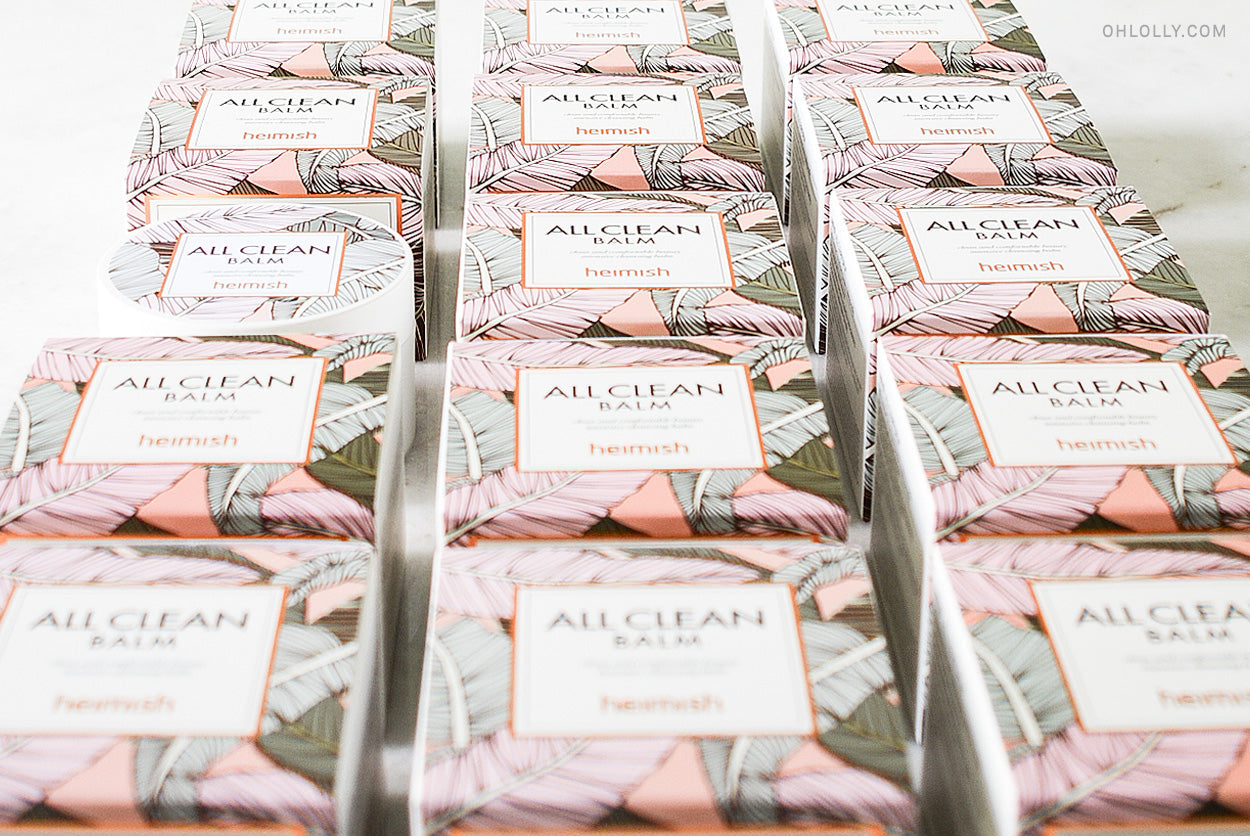 A stack of packaged Heimish All Clean Balm boxes arranged in rows.