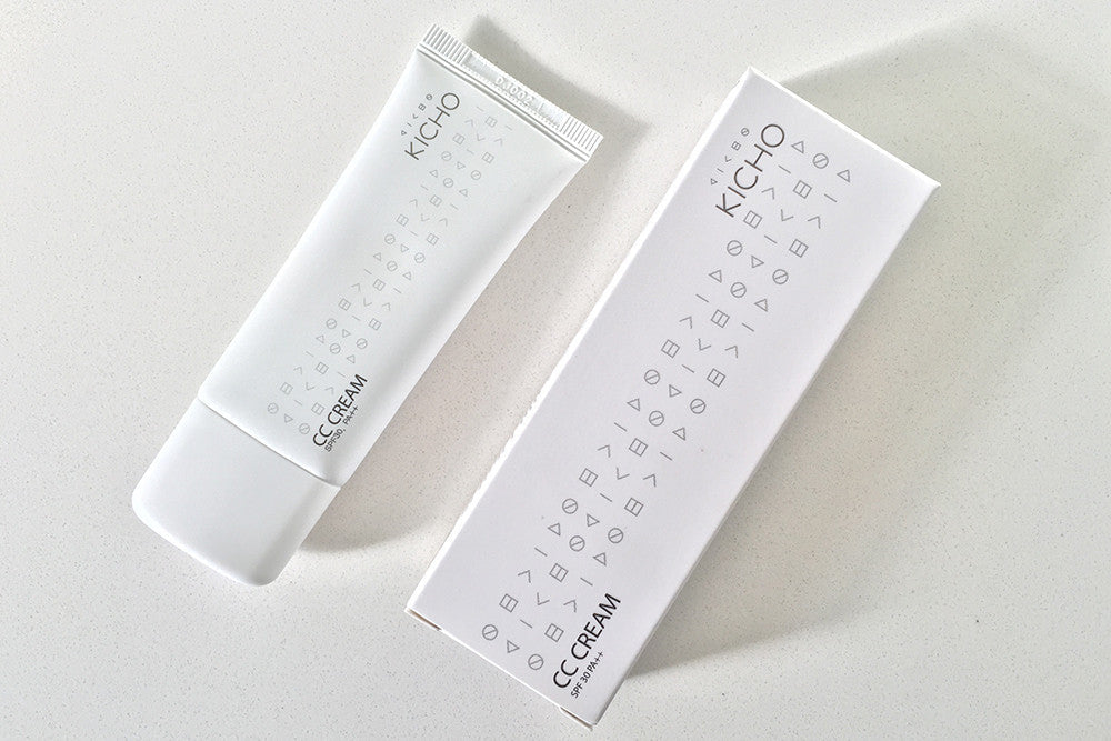 Skincare product and packaging for a Kicho CC Cream, both white and minimalistically designed.