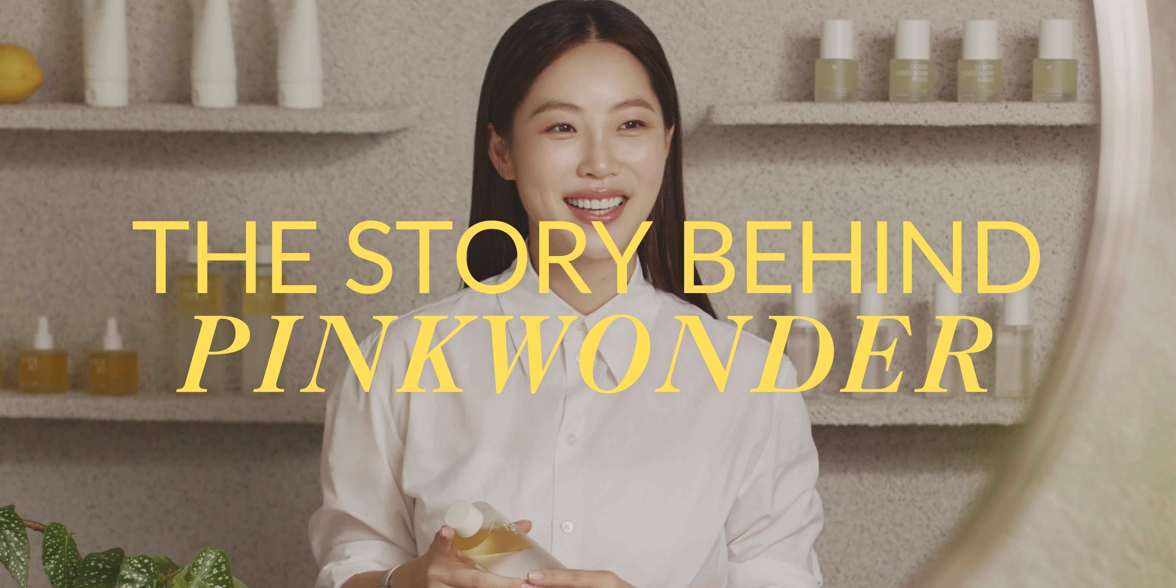 Founder smiling with products for The Story Behind Pinkwonder brand history and mission.