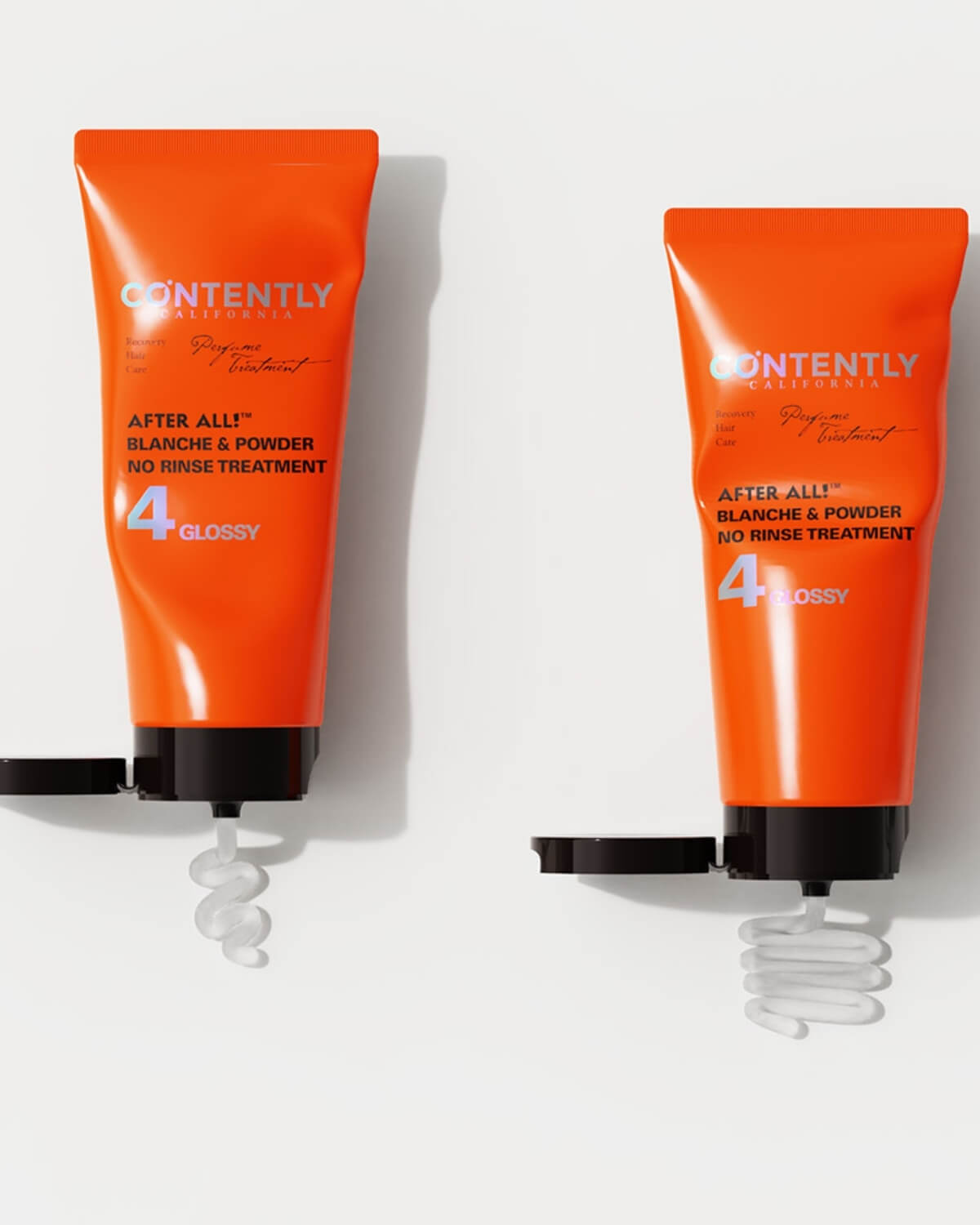 A clean, white studio shot of two identical orange tubes of "After All! Blanche & Powder No Rinse Treatment." The caps are opened, and the clear/white treatment product is extruded in a swirl from the nozzle of each tube.