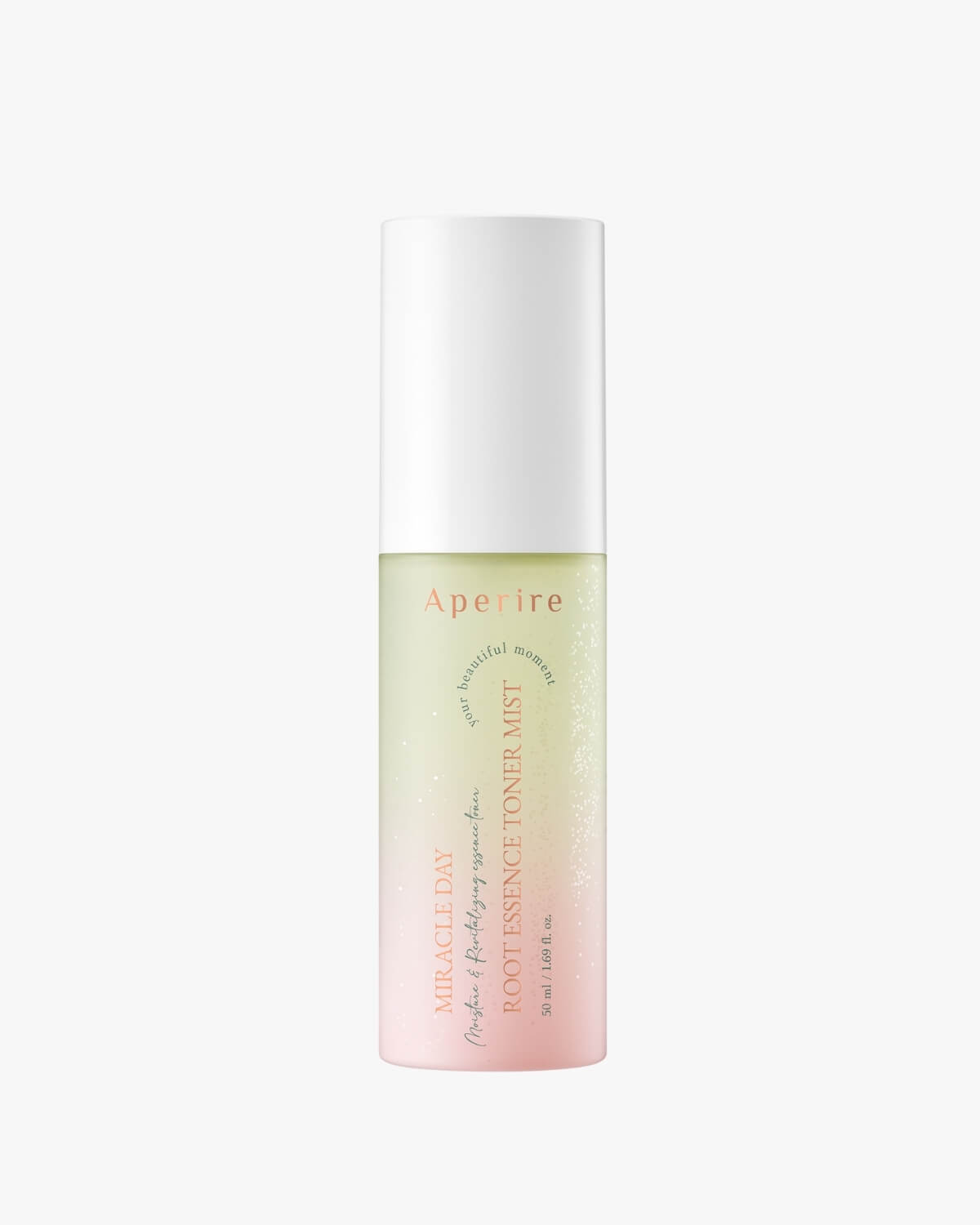 A product shot of the Aperire Miracle Day Root Essence Toner Mist bottle on a plain white background, showing the bi-phase liquid with pale yellow and pink layers. The text on the bottle reads "Miracle Day Root Essence Toner Mist" and "50 ml / 1.69 fl. oz."