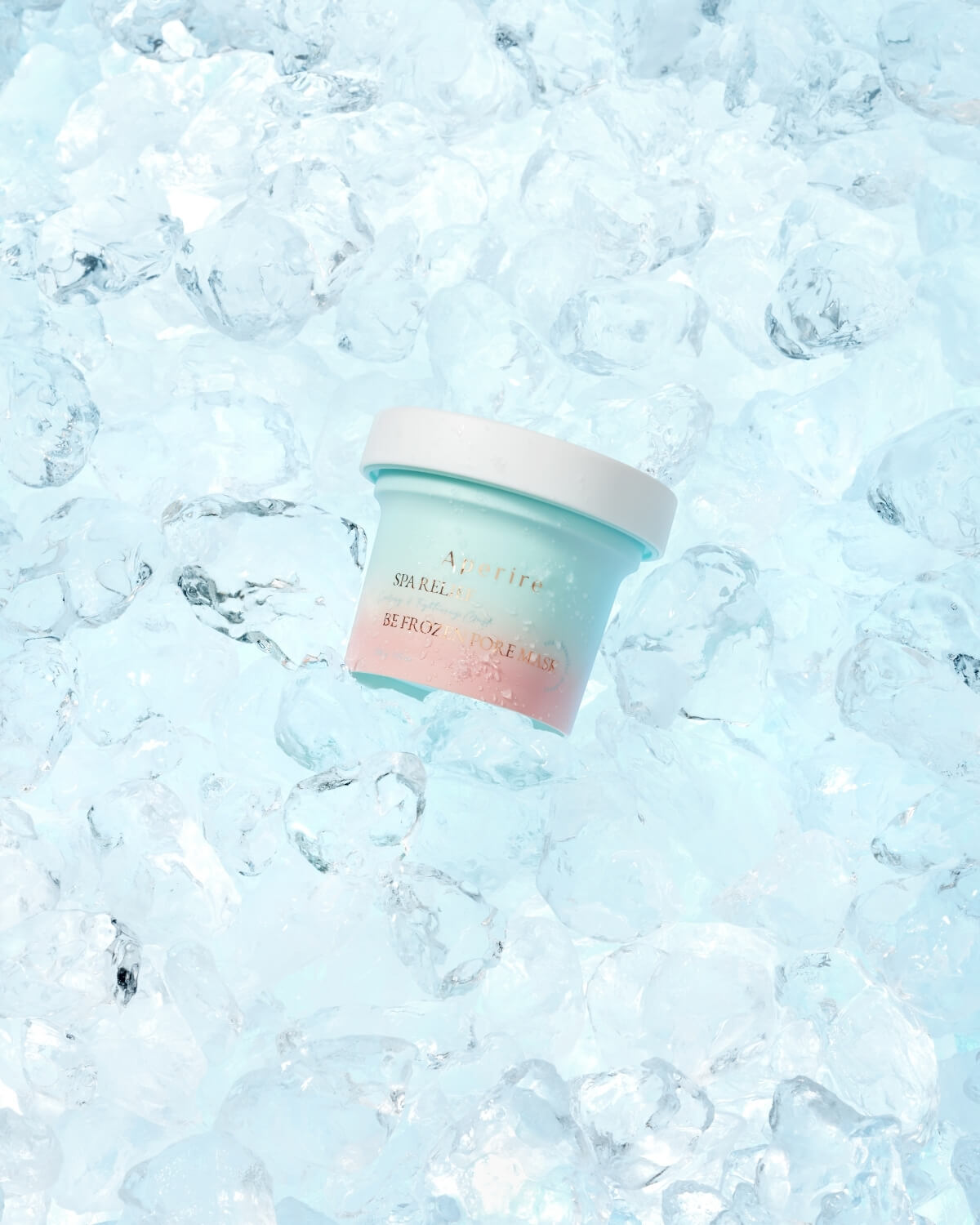 Single jar of Aperire Spa Relief Be Frozen Pore Mask, a cooling and tightening clay mask, surrounded by ice.