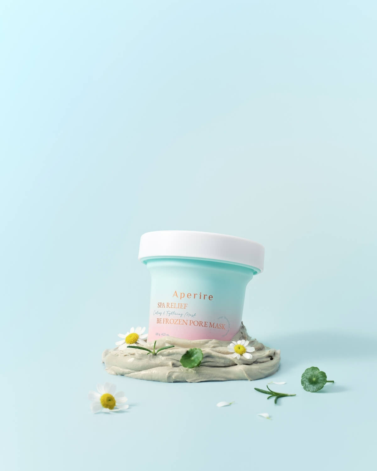 Aperire Be Frozen Pore Mask jar on a clay smear with chamomile and centella asiatica for cooling relief.