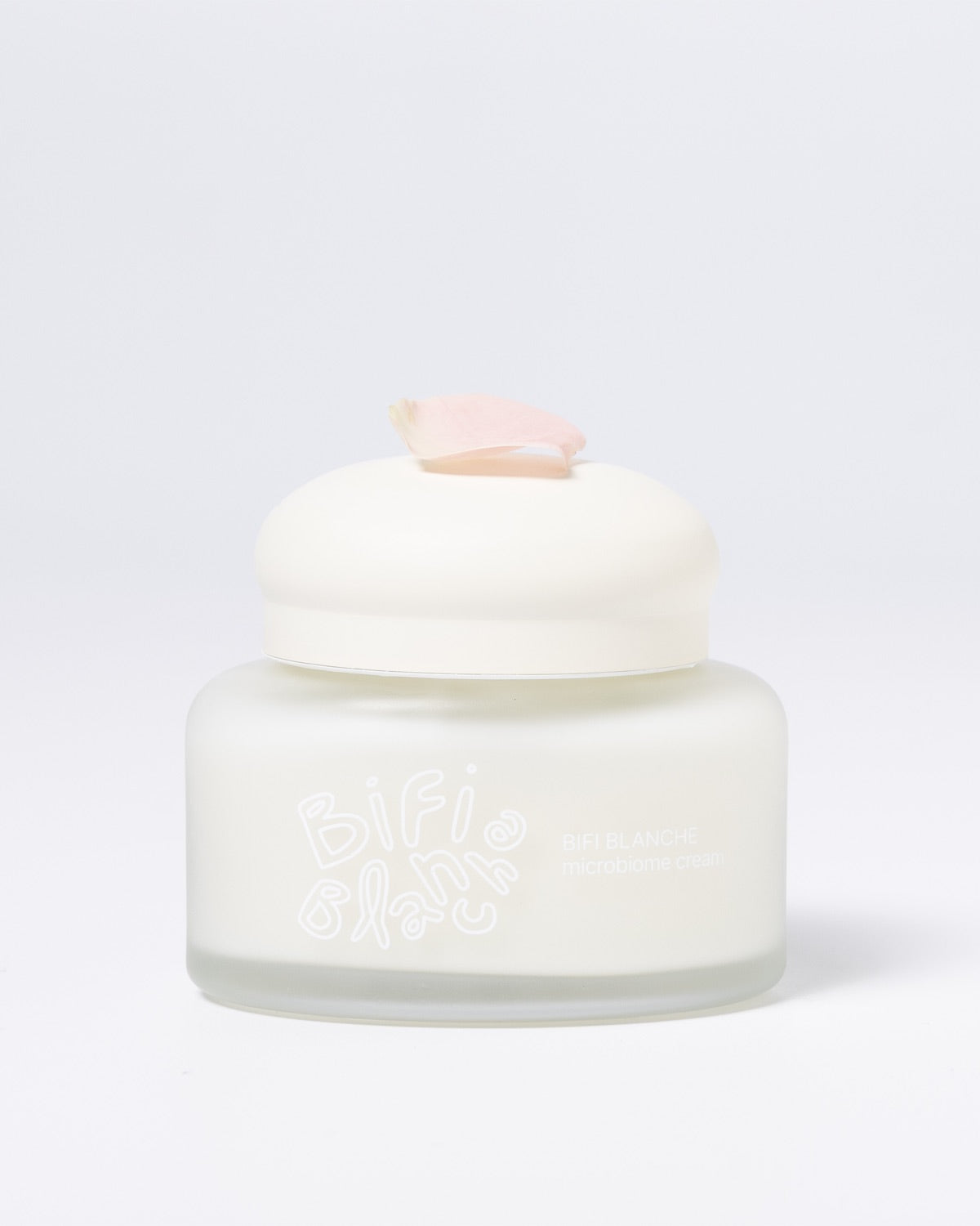 Bifi Blanche Microbiome Moisture Cream jar featuring a soft pink flower petal resting on the white cap.