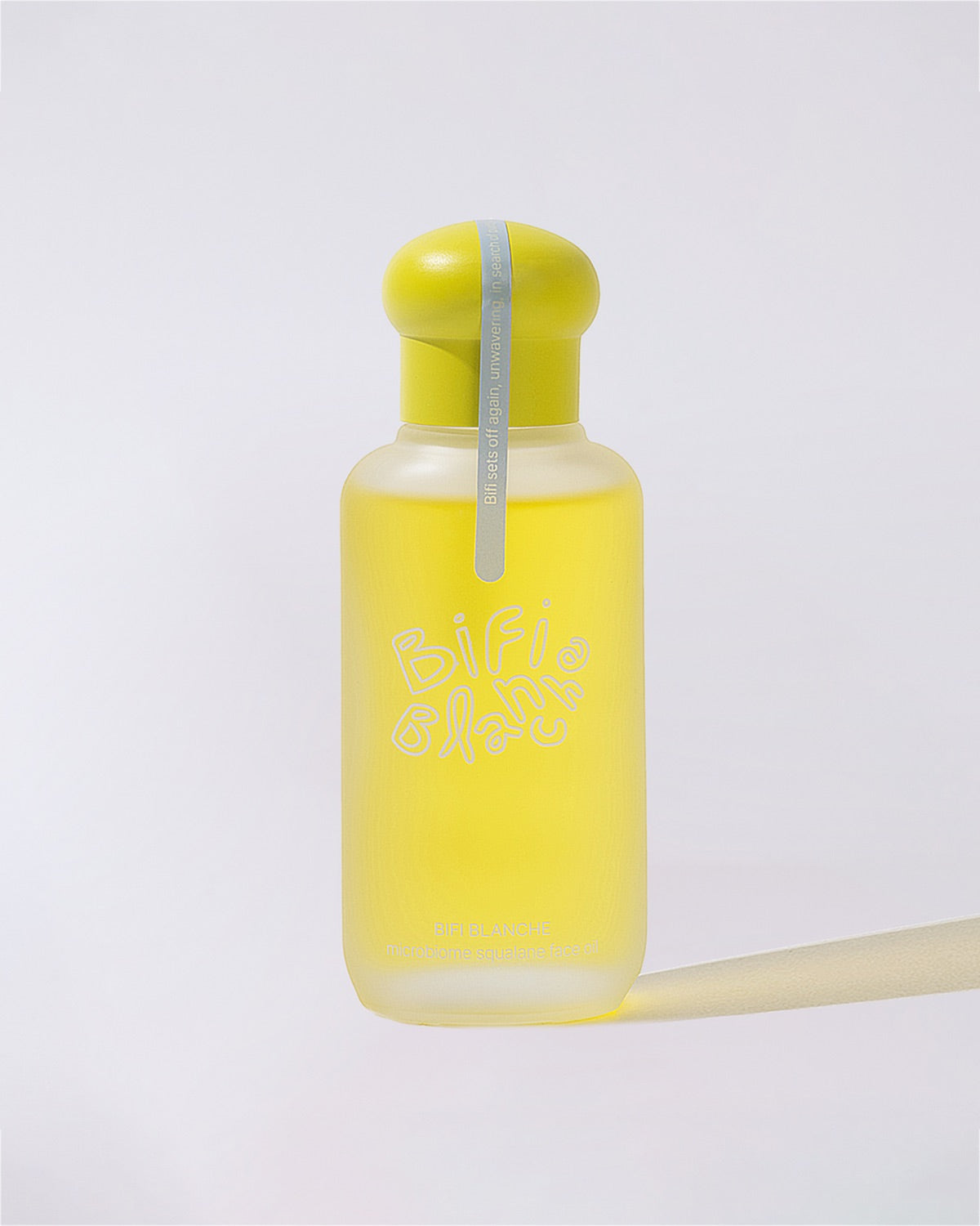 Front view of Bifi Blanche Microbiome Squalane Face Oil bottle with its distinct bright yellow cap.