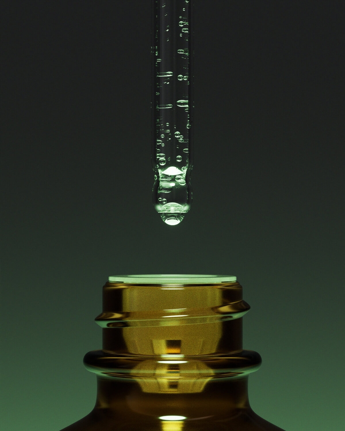 A very close-up, low-angle shot focusing on the neck of an amber bottle and a clear glass dropper. The dropper is full of liquid and has a drop forming at its tip. The background is a gradient of dark green to lighter green, casting a warm glow on the bottle's neck.