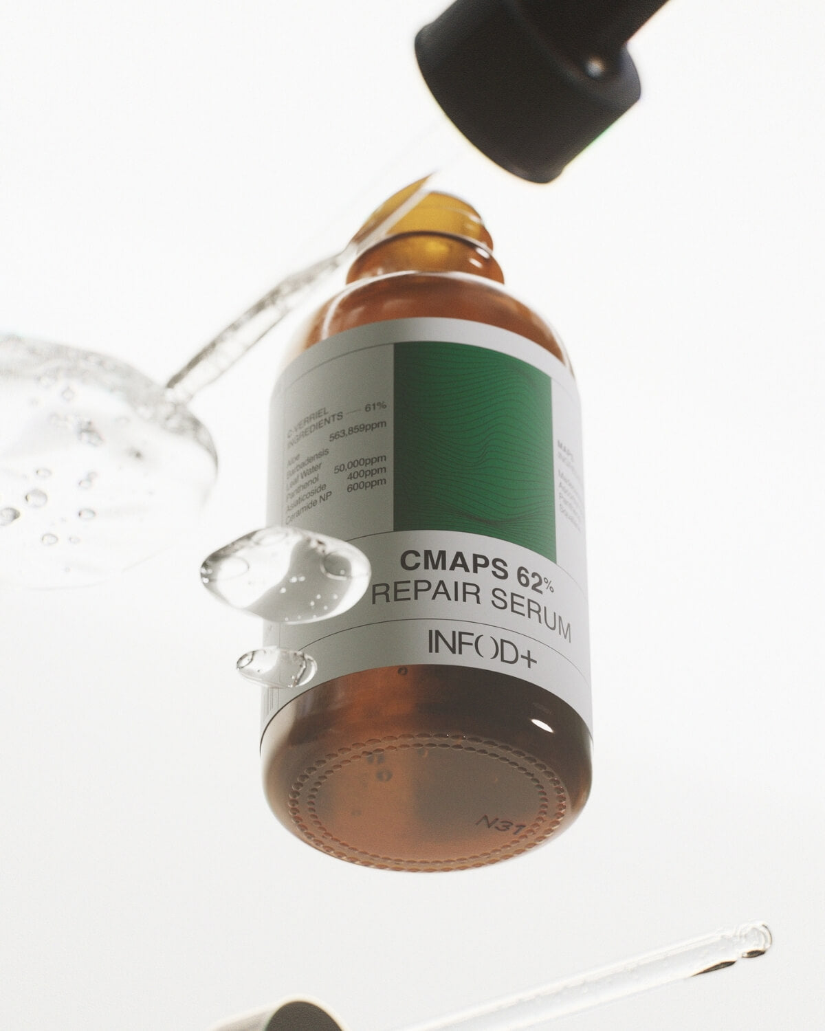 A dynamic close-up shot of an amber dropper bottle with liquid splashing from a dropper above it. Drops of liquid are visible mid-air, and the bottle's label, reading "CMAPS 62% REPAIR SERUM INFOD+", is prominently featured.