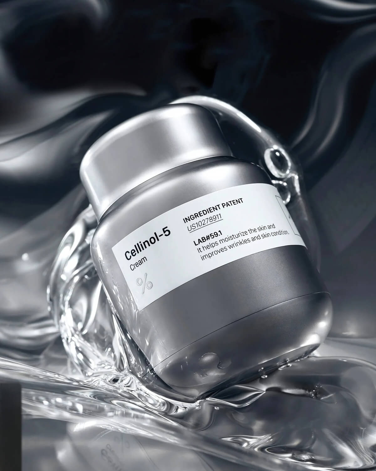 Close-up of the Cellinol-5 Cream jar surrounded by splashing water and dynamic lighting, emphasizing its moisturizing benefits.