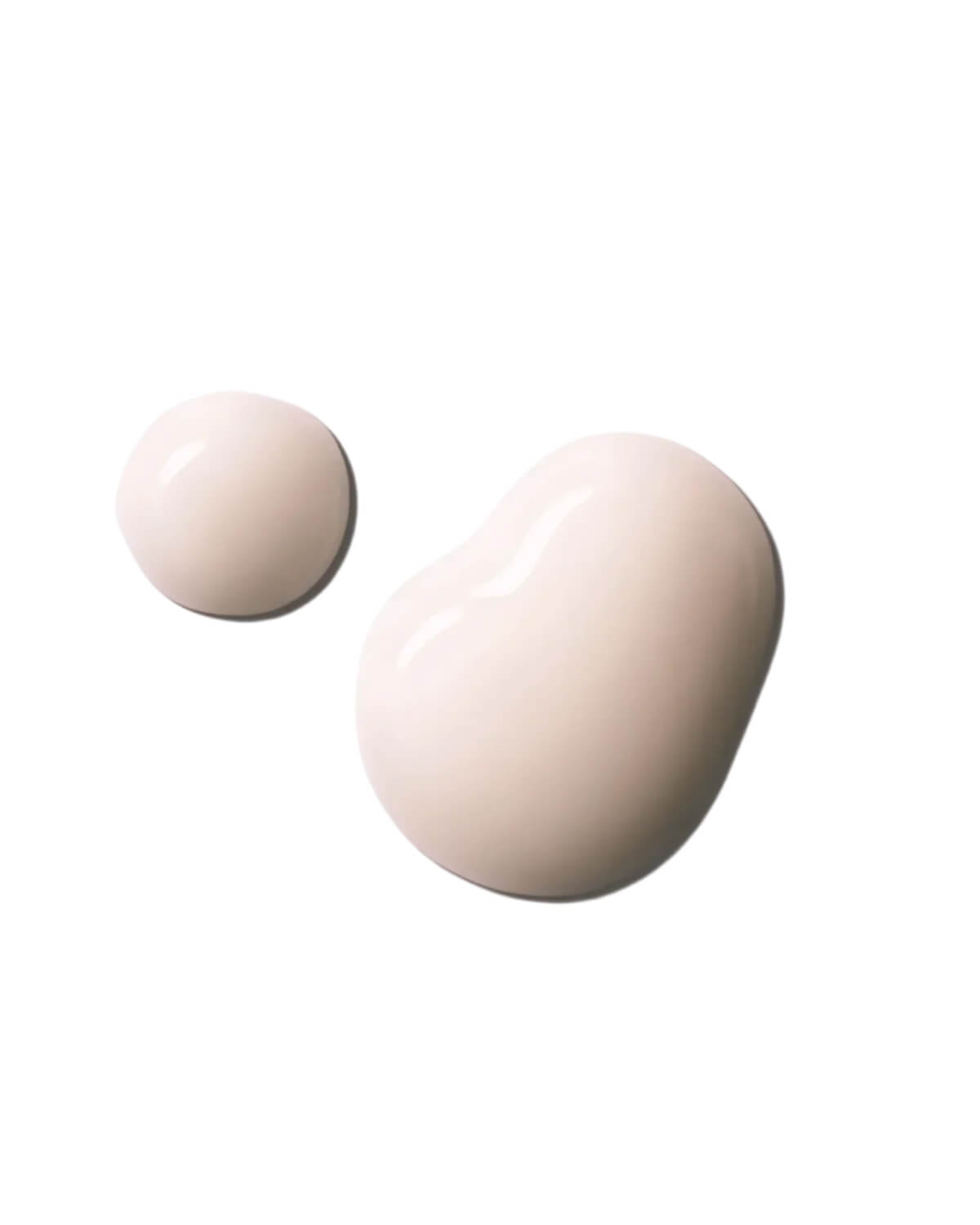 Two drops of the creamy, light-beige Cellinol-5 Serum product are shown on a white background, highlighting its texture and color.