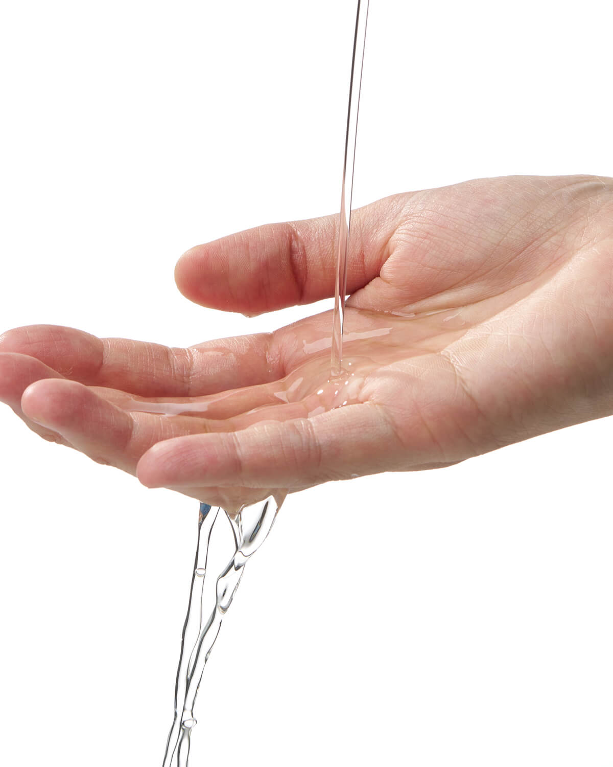 A stream of clear, liquid cleanser is being poured onto an open palm against a white background, showing the product's liquid consistency.