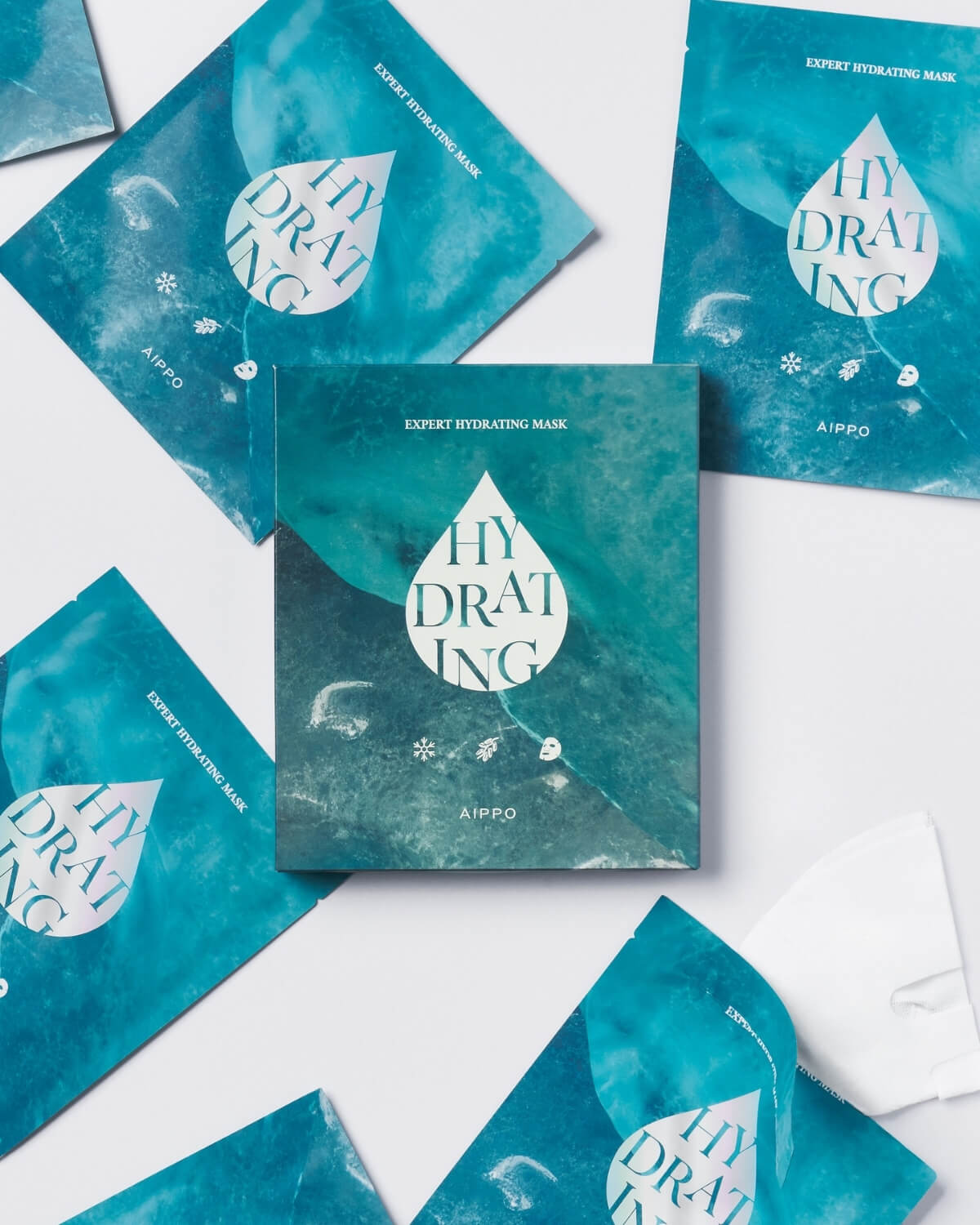 Multiple AIPPO Expert Hydrating Mask packets arranged around a central box. Stock of deep hydrating sheet masks.