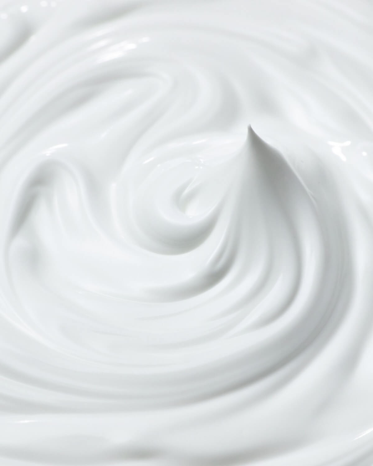 Swirl of white Face Republic Vita Radiance Niacin 10 Cream highlighting a rich, moisturizing texture.