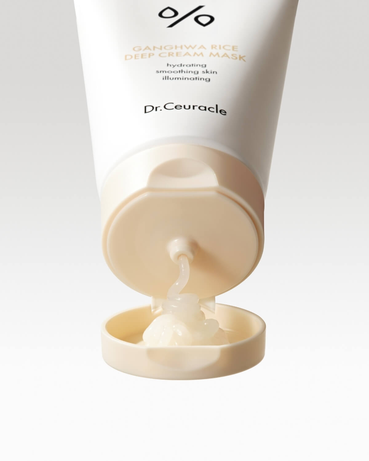 White face cream mask being squeezed directly out of the Dr. Ceuracle tube dispenser.