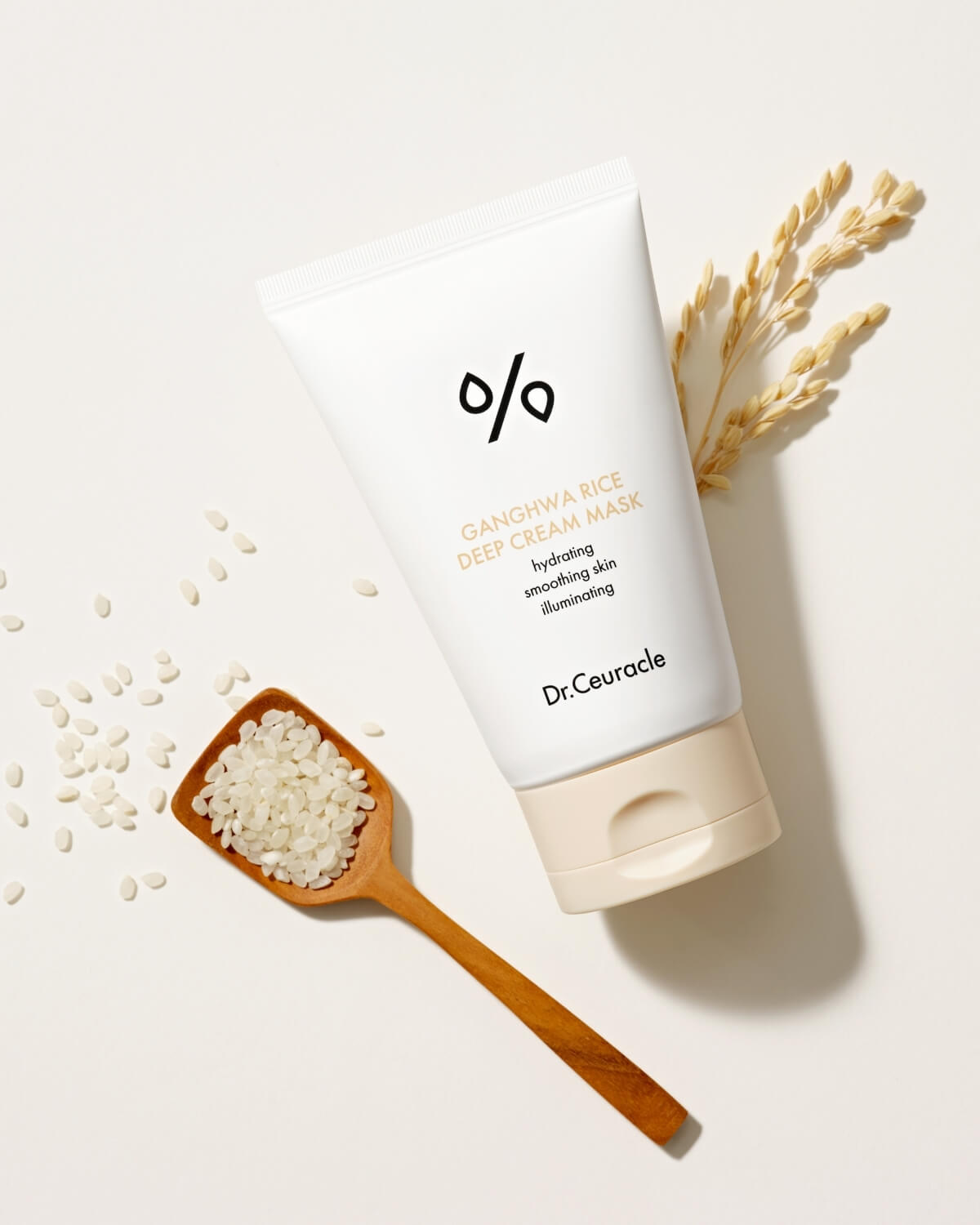 Dr. Ceuracle Ganghwa Rice Deep Cream Mask tube next to a wooden spoon filled with white rice grains.