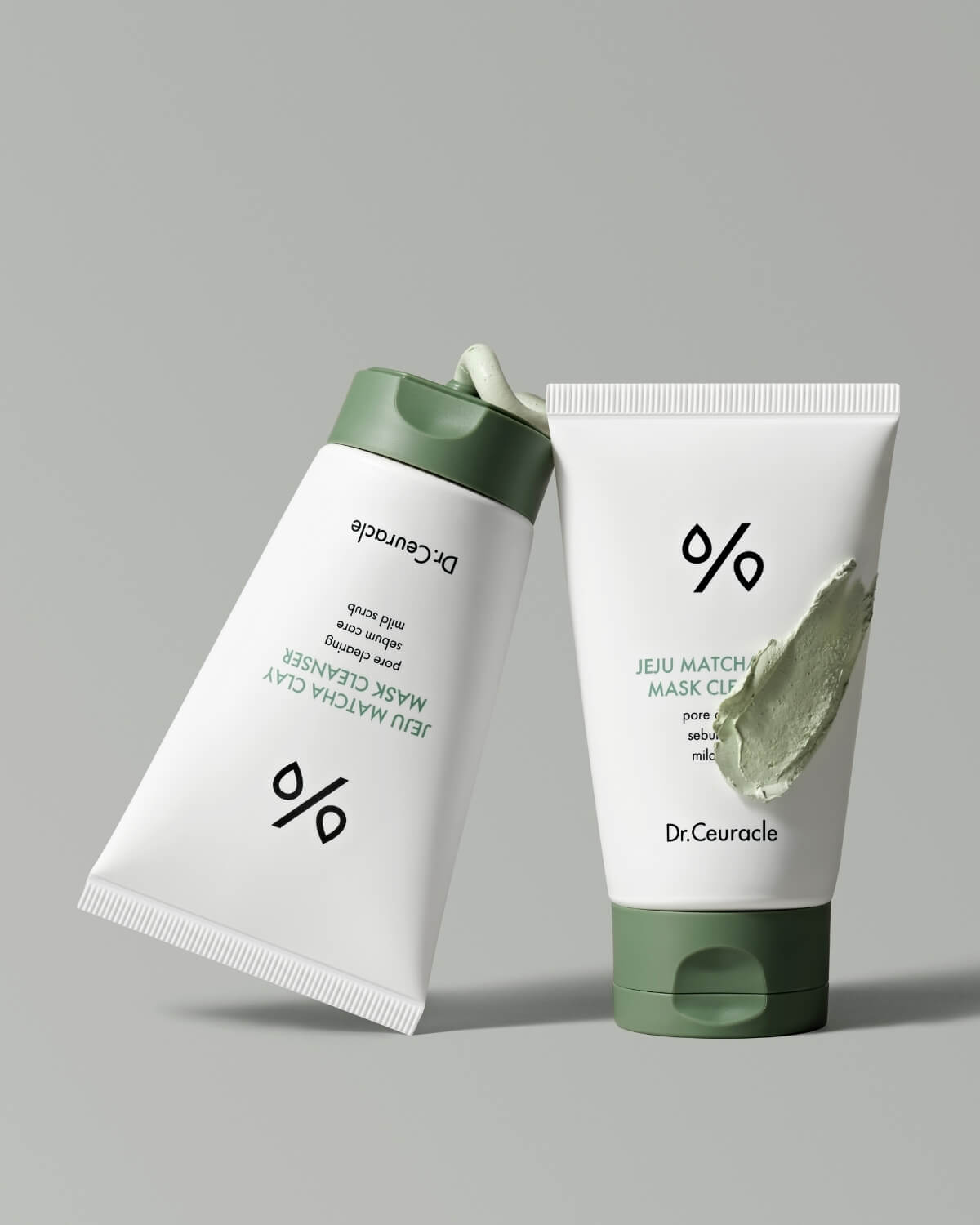 Two tubes of Dr. Ceuracle Jeju Matcha Clay Mask Cleanser showing product squeeze and swatch.