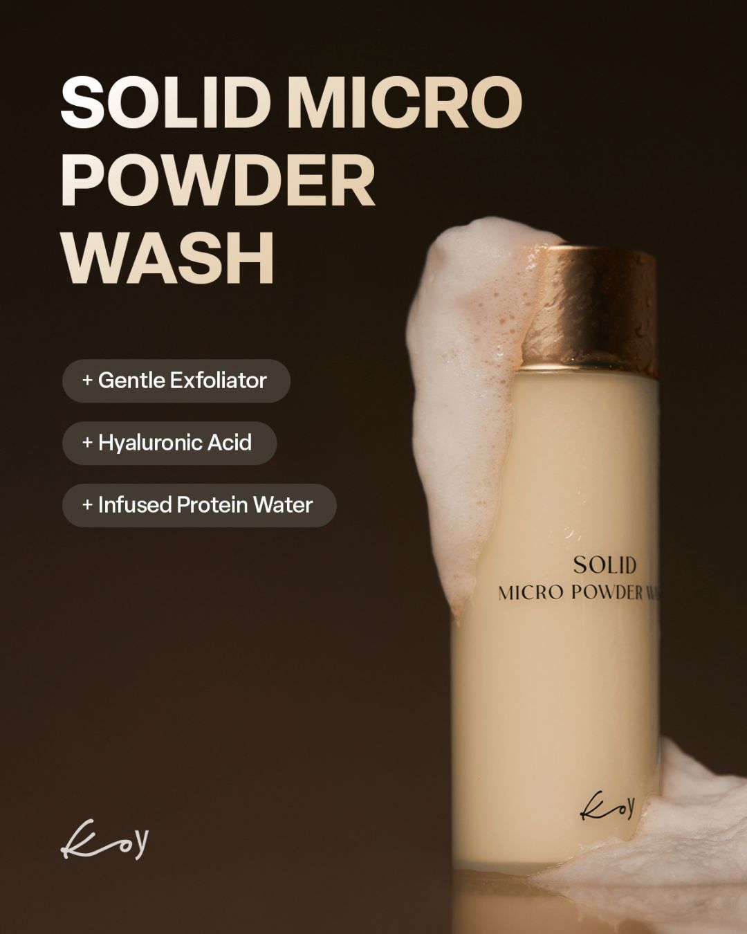 Koy Solid Micro Powder Wash bottle covered in thick foam on a dark background highlighting key ingredients.