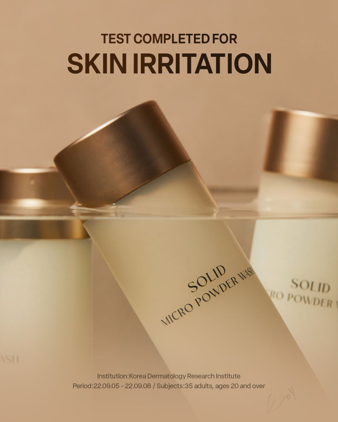 Koy Solid Micro Powder Wash bottles floating in clear water with skin irritation test completion text.