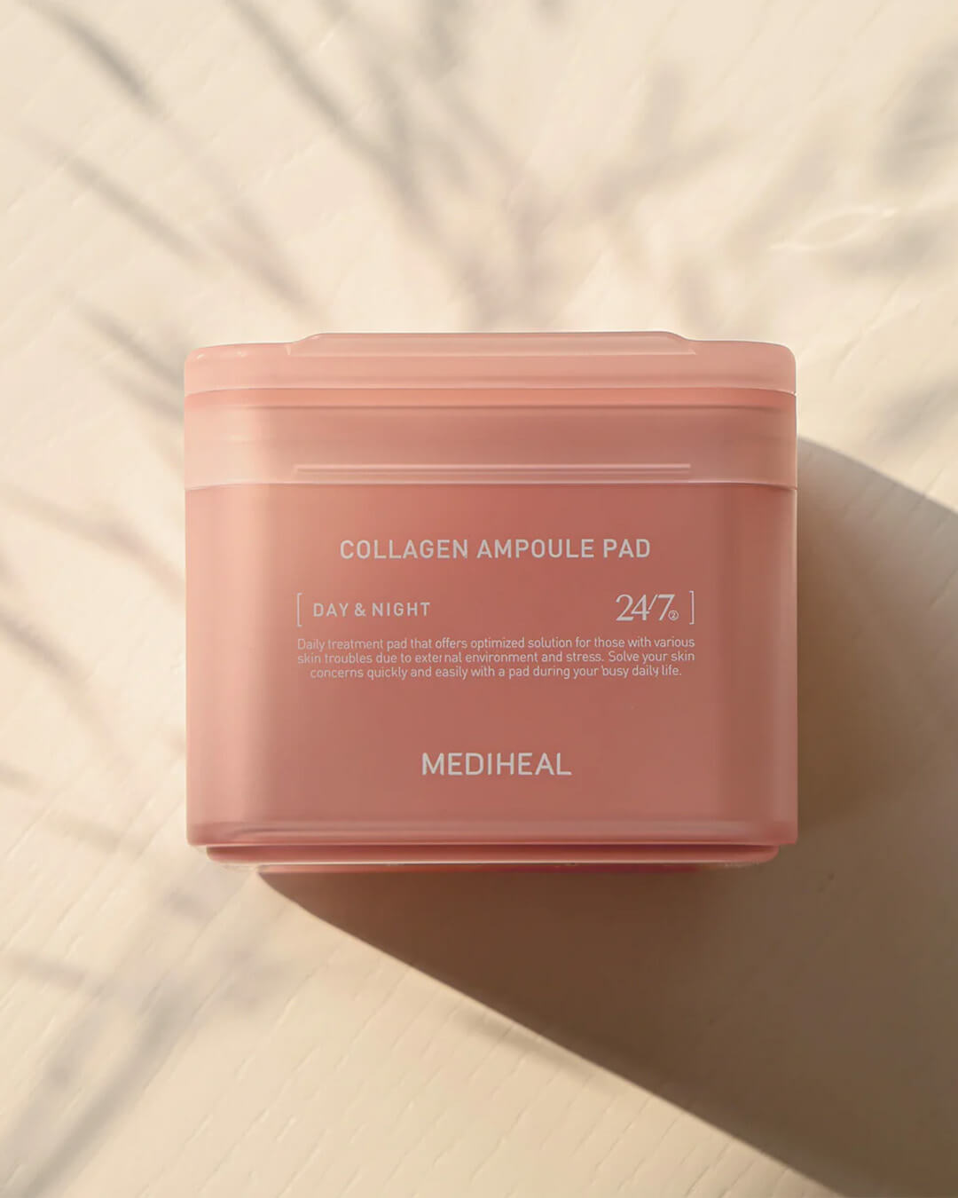 Mediheal Collagen Ampoule Pad_Collagen-boosting Multi-tasking Treatment, product on a cream background