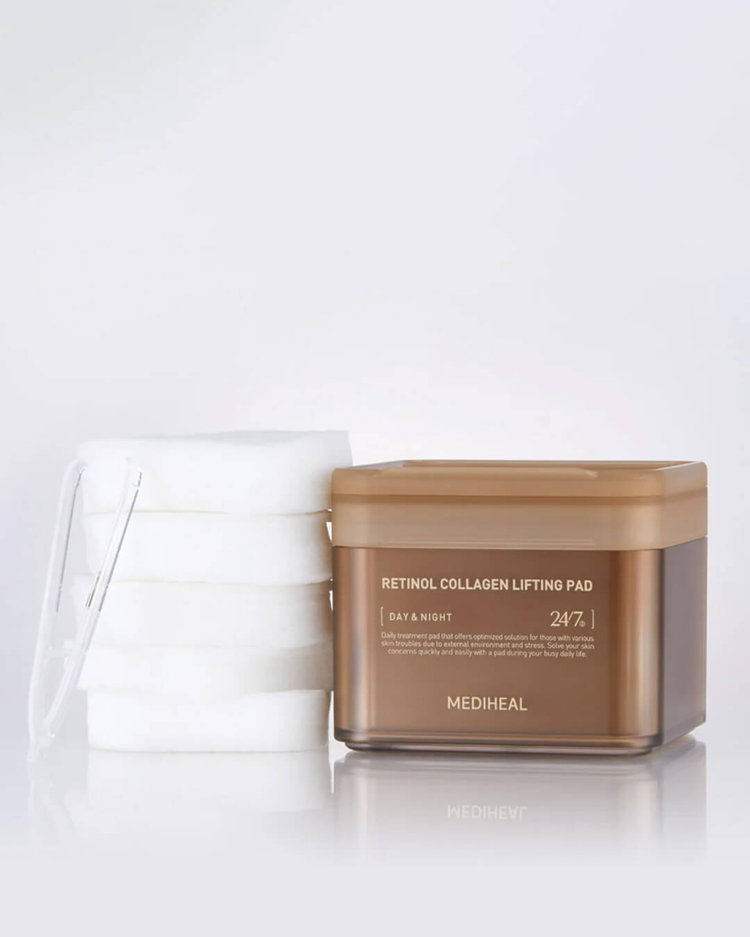 Mediheal Retinol Collagen Lifting Pad_Repairing, Firming & Collagen-boosting Treatment, product jar, cotton pads, and plastic tweezer on a table top