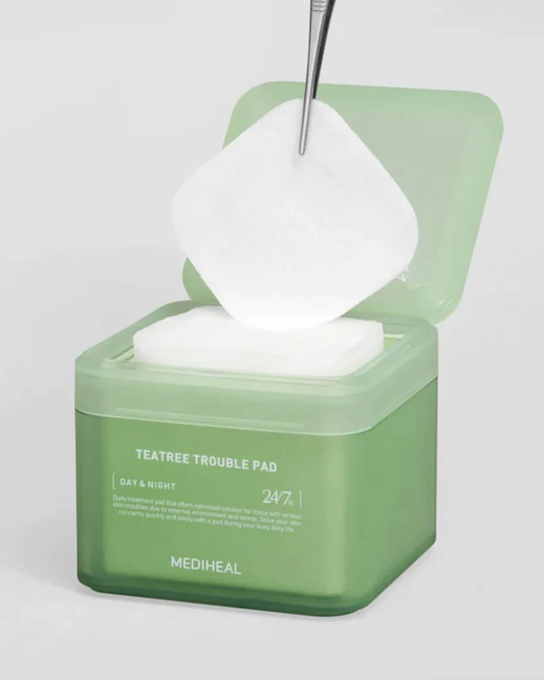 Mediheal Tea Tree Trouble Pad_Daily Toner + Treatment Mask Pad, lifting the cotton pad with a tweezer