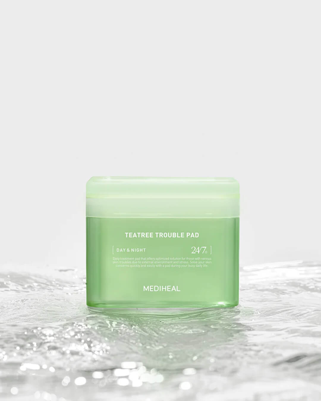 Mediheal Tea Tree Trouble Pad_Daily Toner + Treatment Mask Pad, product on a white background with water on the bottom part of the image