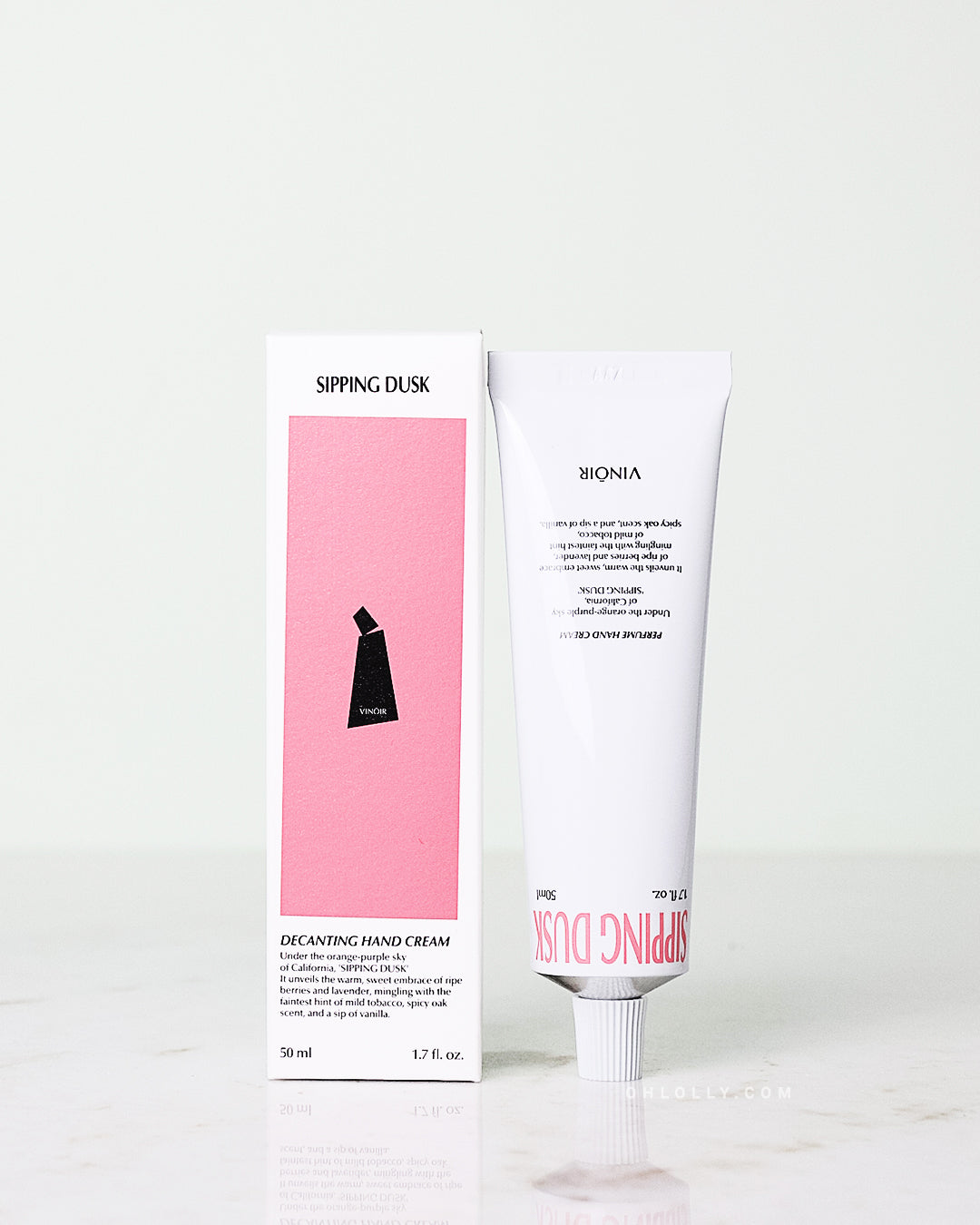 Ohlolly Korean Skincare Vinoir Decanting Hand Cream | Sipping Dusk, Scented moisturizer for dry hands. Box and product on tabletop.