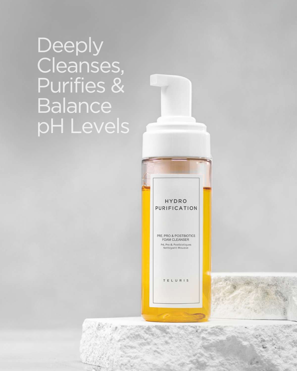 Teluris Hydro Purification Foam Cleanser bottle on stone. Deeply cleanses and balances pH levels.