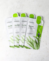 Mediheal Tea Tree Essential Mask_Intensive Calming & Clarifying Mask, 4 pieces of product on a white background