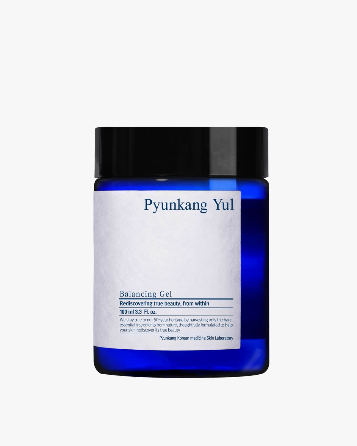 A cobalt blue glass jar of Pyunkang Yul Balancing Gel with a white textured label and a black screw-top lid.