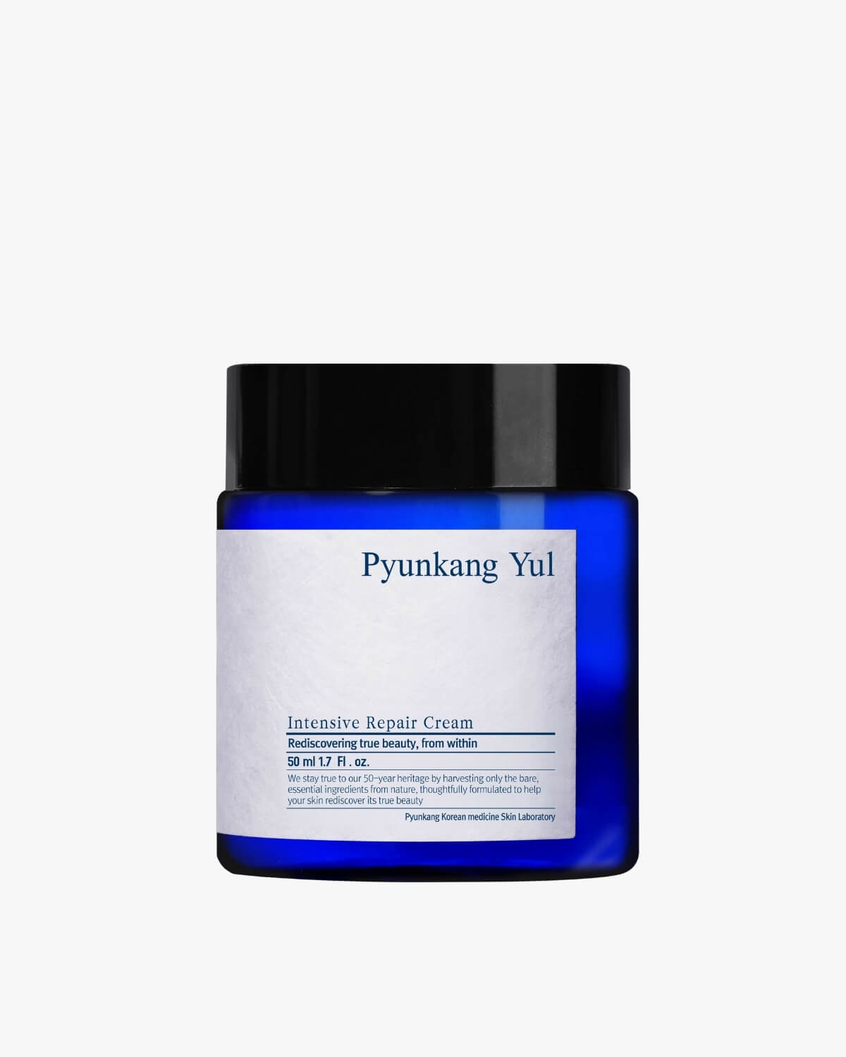 A small, dark blue jar with a black lid, labeled "Intensive Repair Cream."