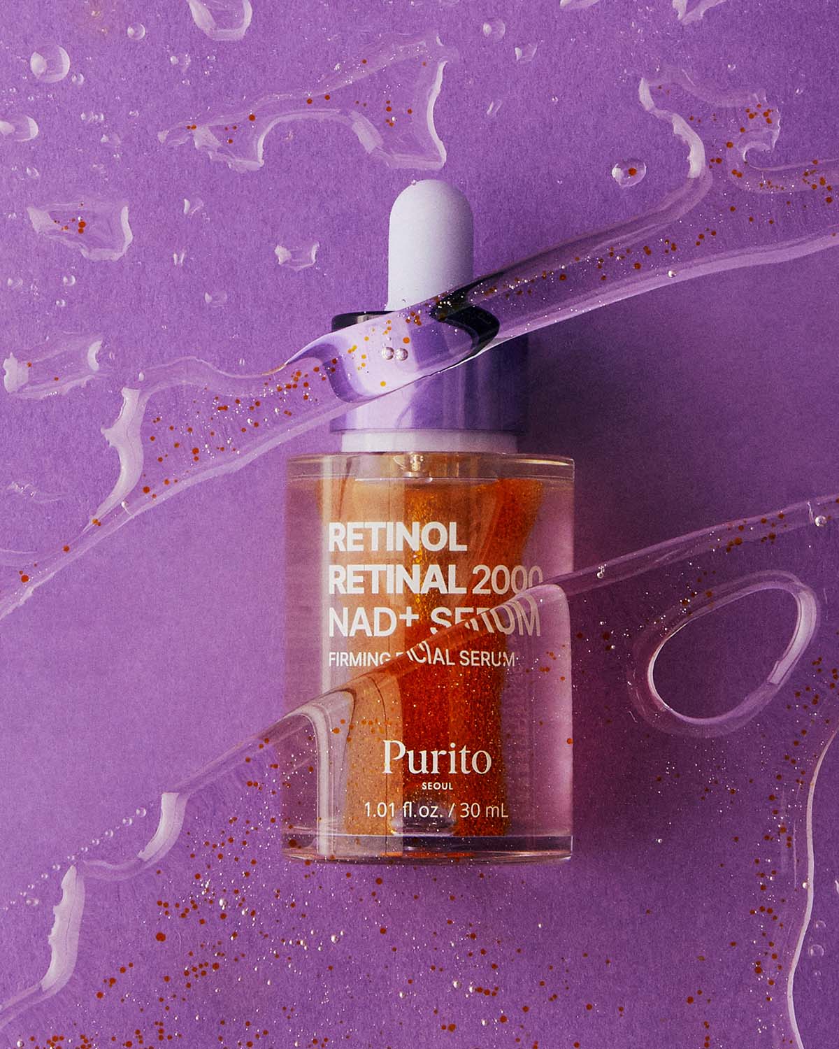 Purito Retinol Retinal 2000 NAD+ Serum bottle seen through wavy, clear liquid textures.