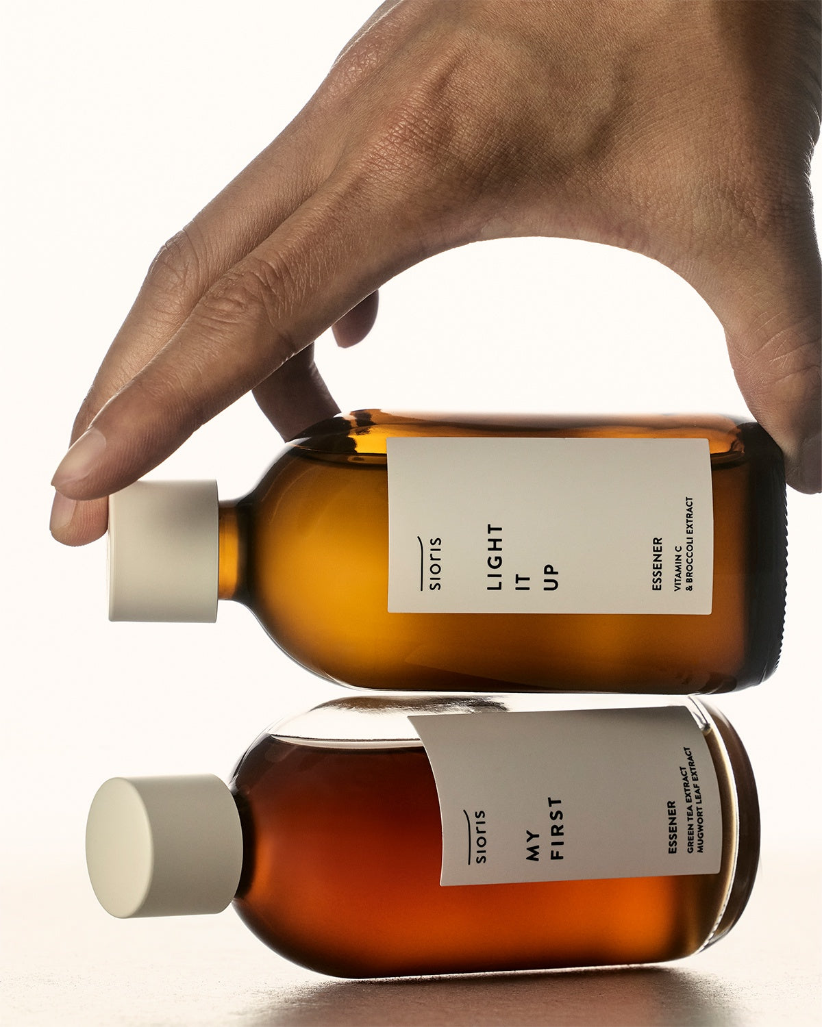 Sioris Light It Up Essener brightening formula for reducing fine lines and wrinkles, showing next to Sioris My First Essener