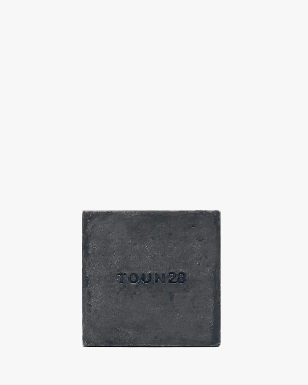 Toun28 S21 black shampoo bar with black soybean and charcoal on white background