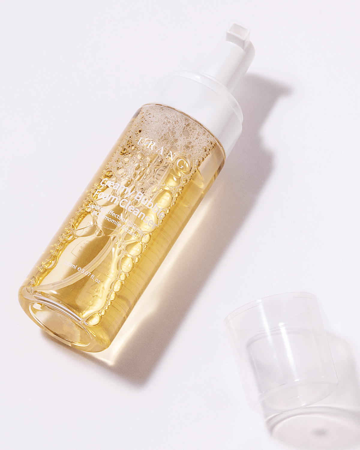 Urang Creamy Bubble Foam Cleanser bottle close-up, highlighting its 99.9% natural, vegan formula gentle enough for sensitive skin and babies.