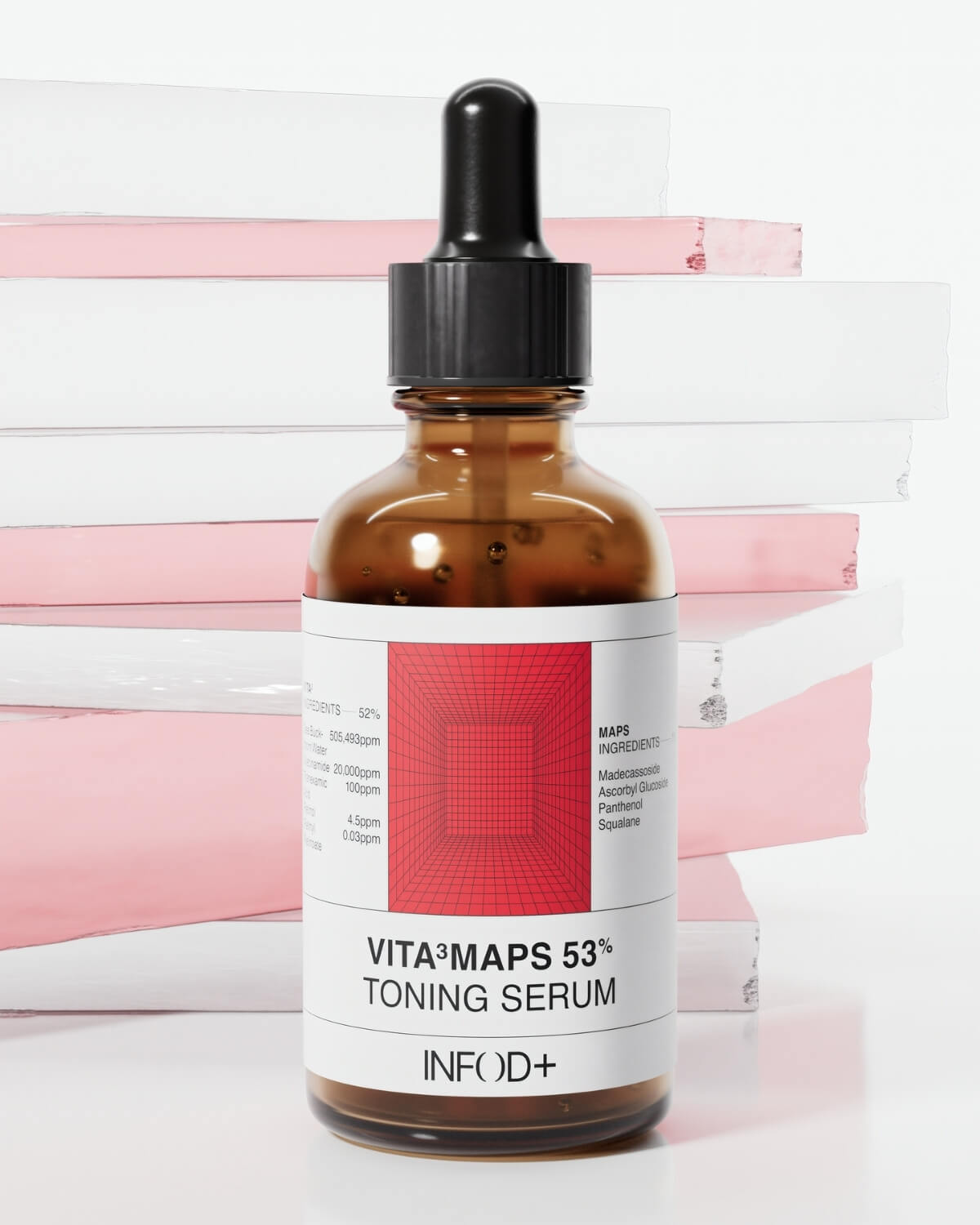 A brown glass dropper bottle of VITA³MAPS 53% Toning Serum with a black cap is positioned in front of a vertical stack of alternating pink and white books or blocks.