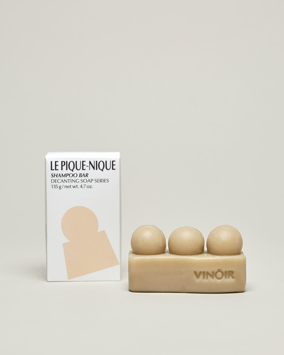 Ohlolly Korean Skincare Vinoir Decanting Shampoo Bar | Le Pique-Nique. Beige bar soap and box on tabletop. Bar soap has unique shape to massage while washing.