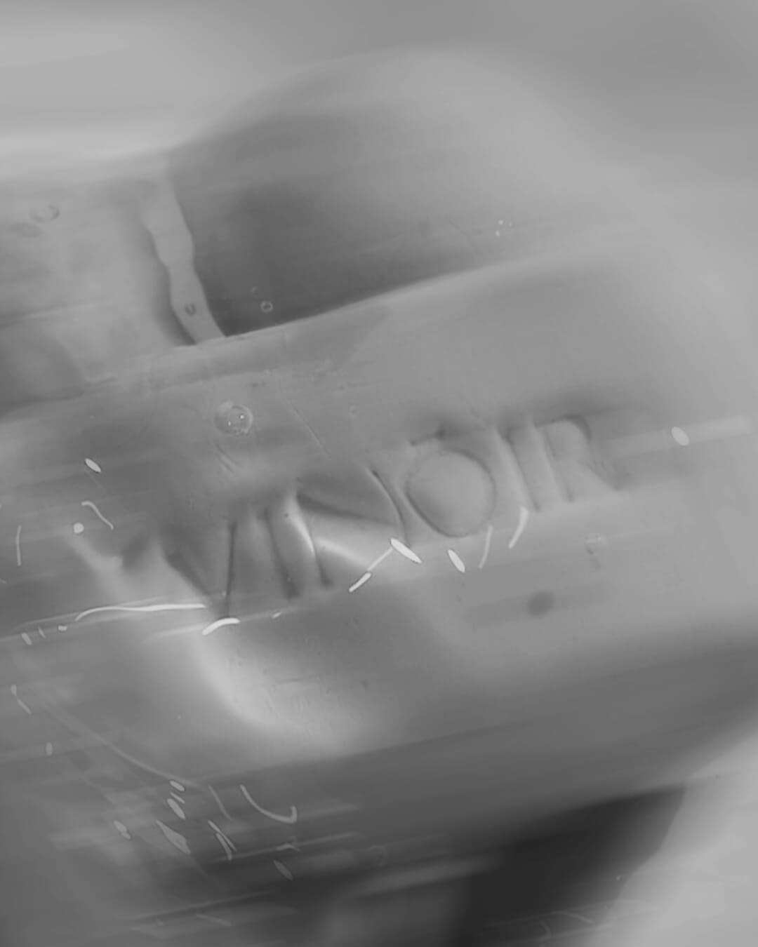 Vinoir Sipping Dusk shower bar black and white stylized photo showing smooth texture