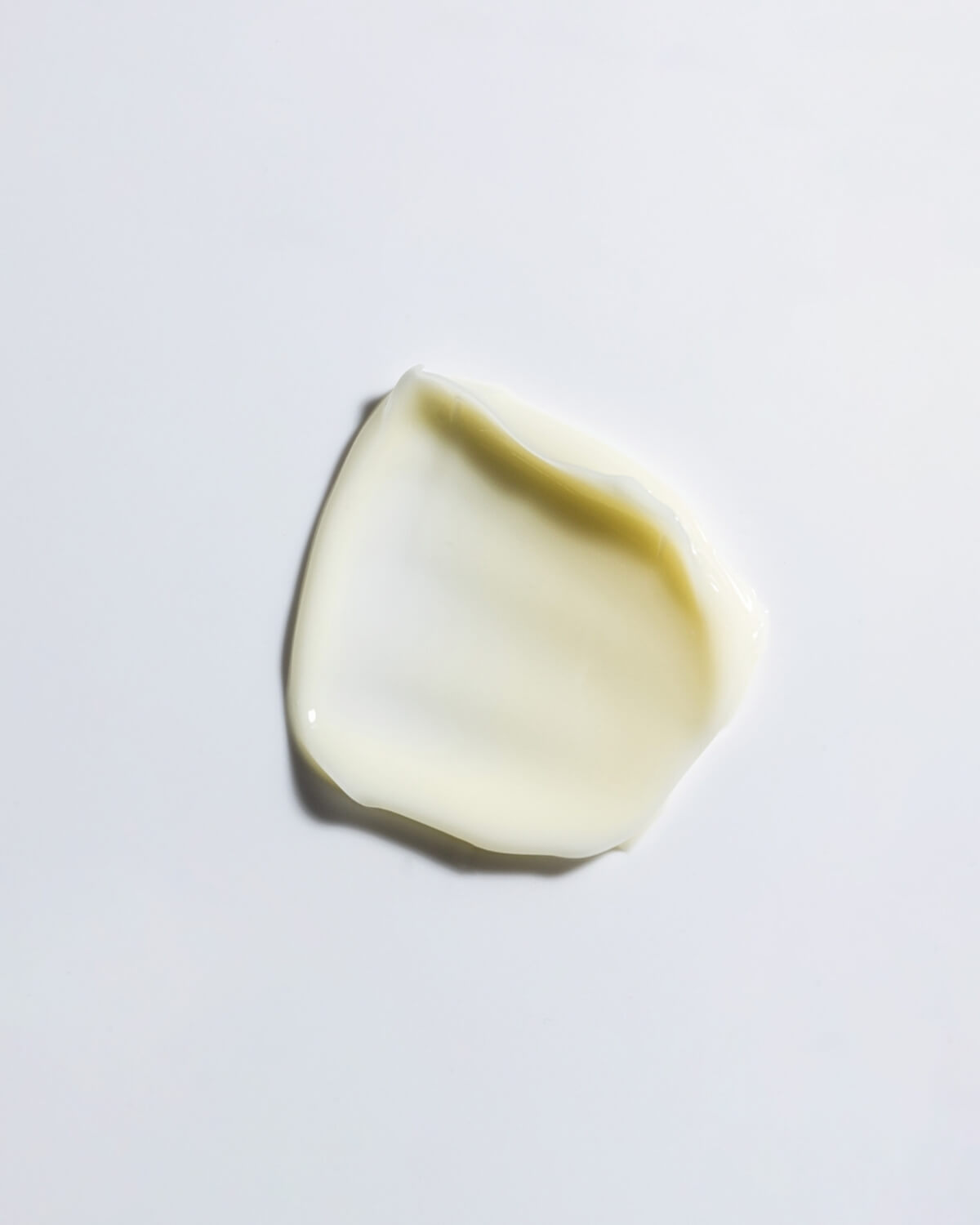 A smooth, creamy swatch of the WYLYS New Day Glow Vitamin C and Bakuchiol Brightening Pressed Serum.