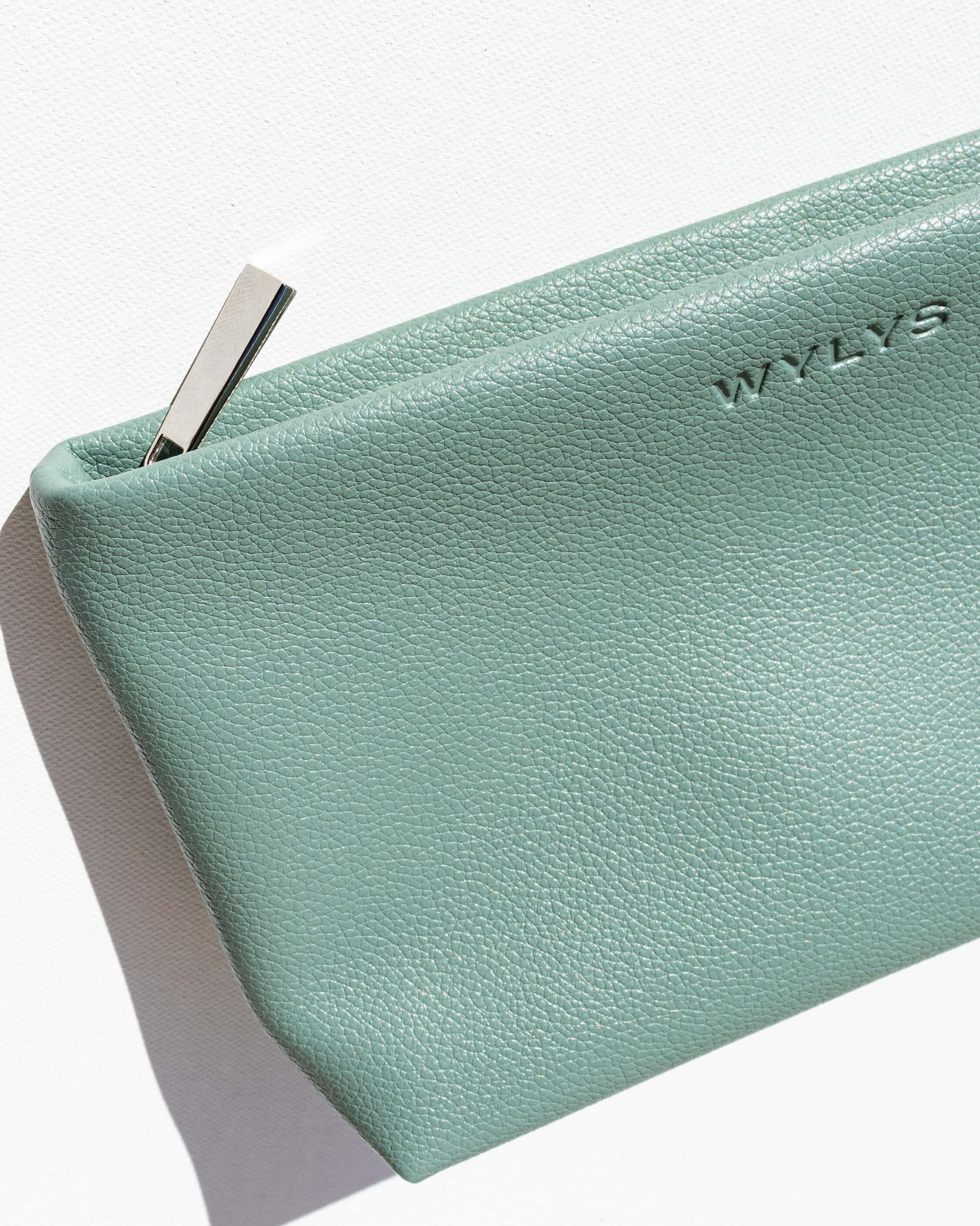 WYLYS Sage Verte Makeup Bag Soft Vegan Leather Water-resistant Silver Metal Pull Pebble texture Debossed logo Carry skincare and makeup