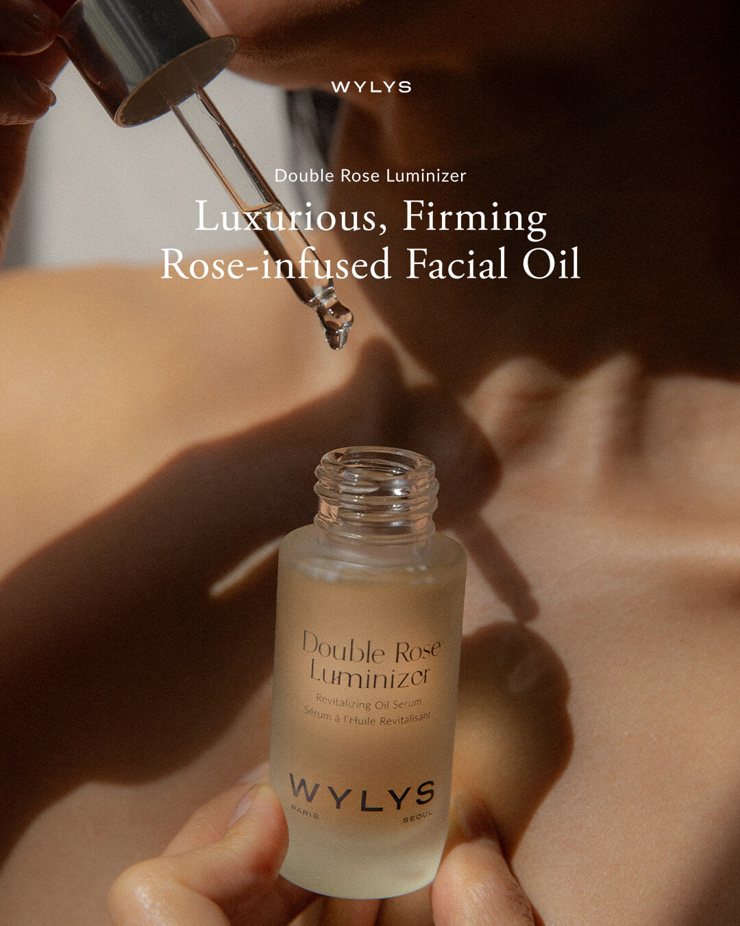 WYLYS Double Rose Luminizer Luxurious Firming Rose-infused Facial Oil Made in France Model holding bottle showing texture of product. Lightweight oil blend. Vegan Cruelty free. Made with organic ingredients.