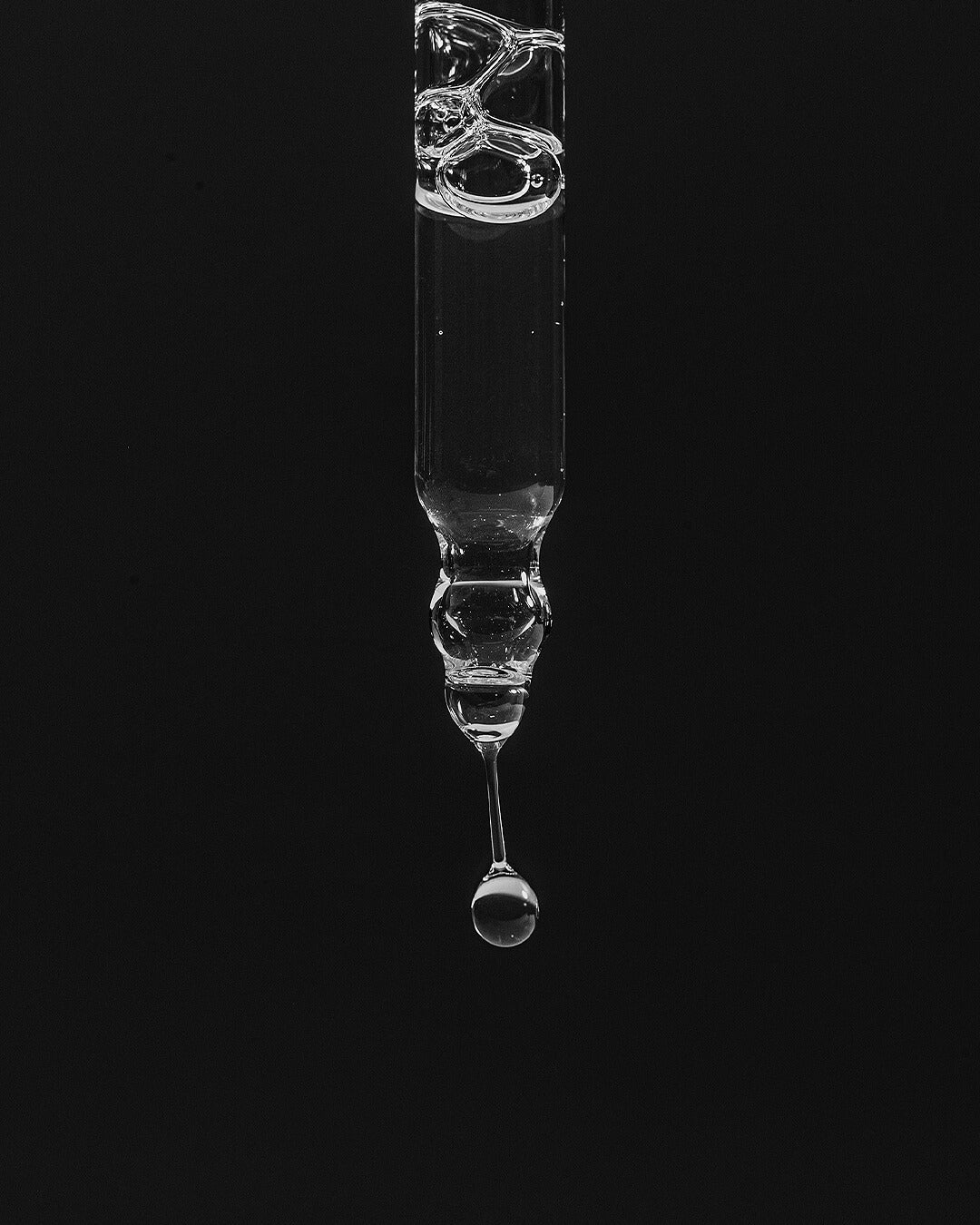 WYLYS Double Rose Luminizer Texture When You Love Your Skin Closeup of texture. Droplet from pipette. Oil. Luxury. Made in France. Vegan. Cruelty free. Organic.