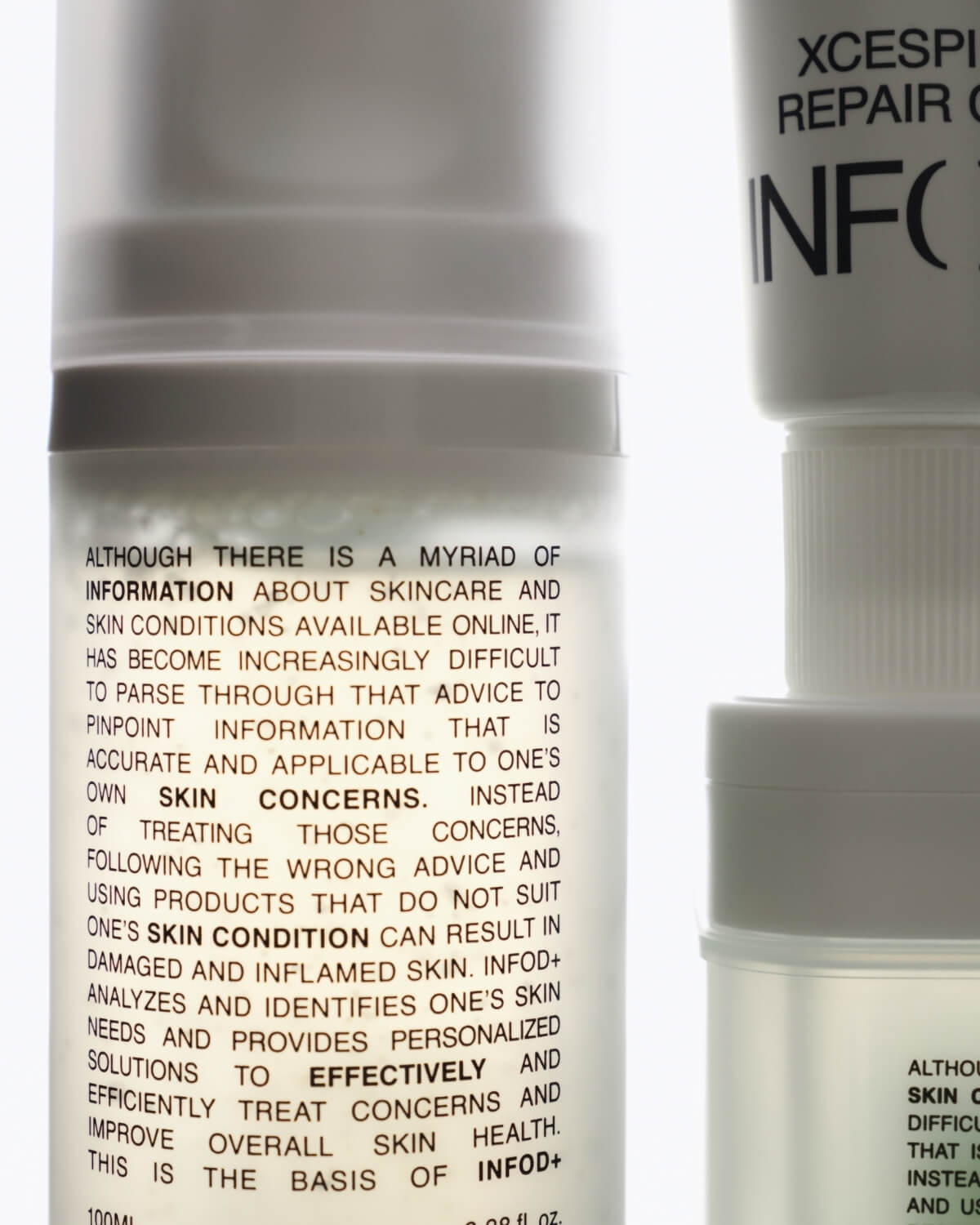 Close-up of the label text on the INFOD+ XCESPI 316™ Gel Cleanser bottle, with other out-of-focus products stacked to the right.