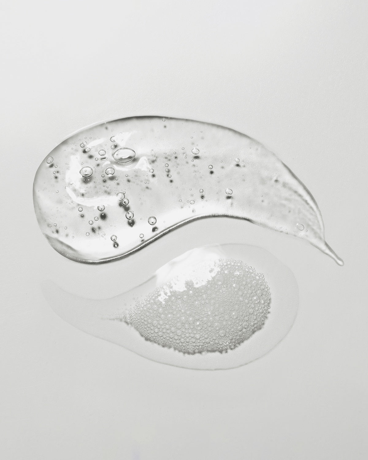 Swatches of Haruharu Wonder Black Rice Triple AHA Gentle Cleansing Gel and foam texture. Gentle exfoliation.