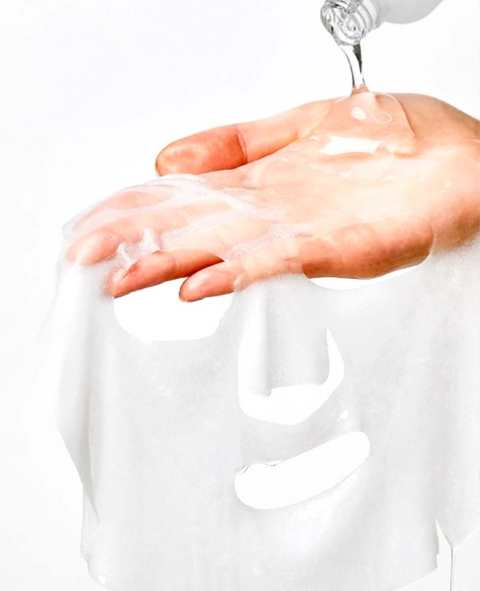 ma:nyo Galac Niacin Essence Mask_Instantly more radiant skin, hand holding the product with ampoule