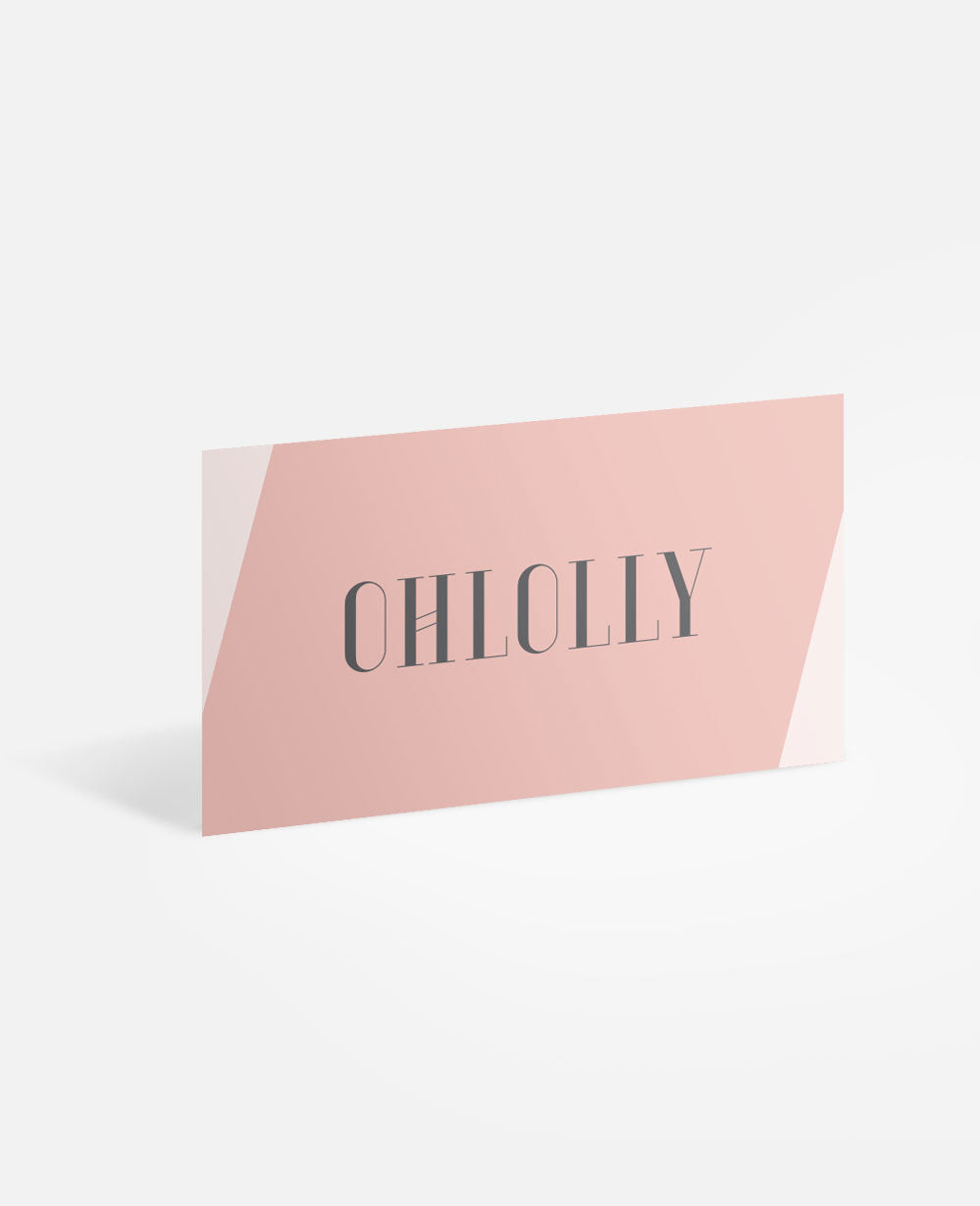 A minimalist illustration of the Ohlolly E-Gift Card, angled upright on a white surface, featuring a light pink and white design with the dark text 'OHLOLLY' centered across the card.
