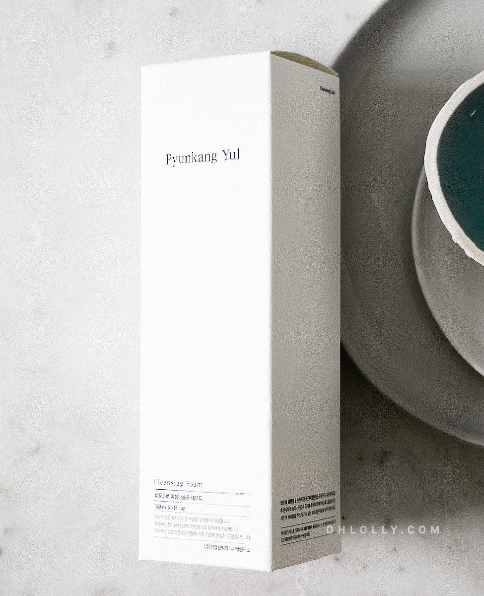 Front-on studio shot of the white Pyunkang Yul Cleansing Foam outer box, highlighting the minimalist packaging and the product's focus on deep cleansing. The image emphasizes the brand's simple, honest approach to skincare."