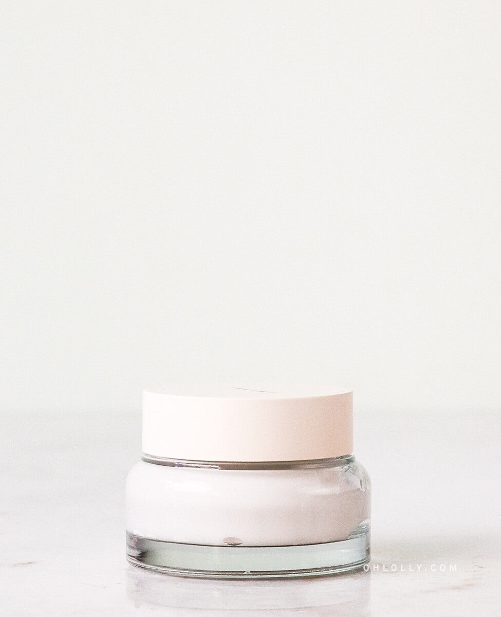 Sioris Enriched by Nature Cream jar with organic shea butter on plain background