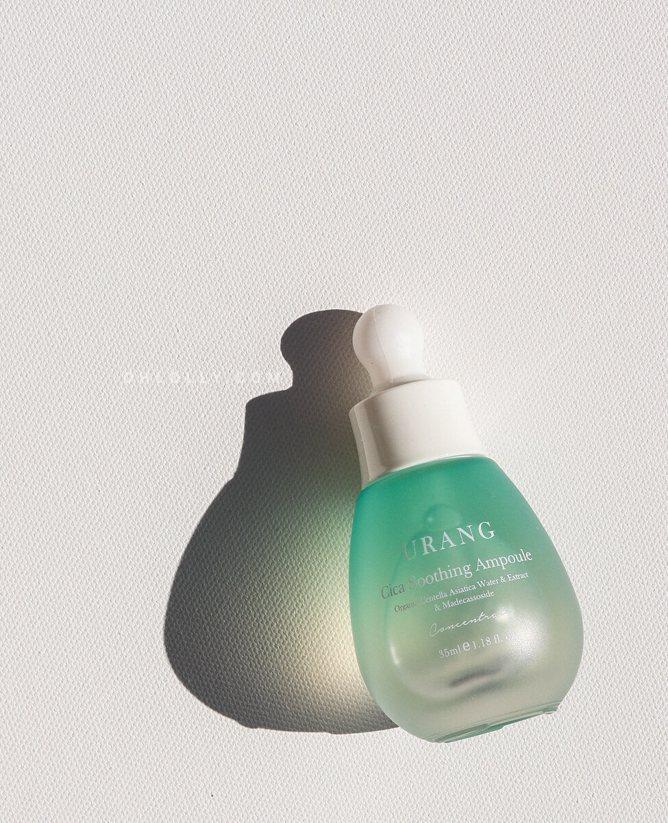 Urang Cica Soothing Ampoule bottle with a light green tint, emphasizing the soothing and repairing power of organic Centella asiatica for sensitive skin.
