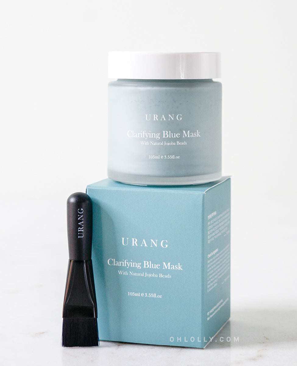 Jar and box of Urang Clarifying Blue Mask, a brightening wash-off treatment with Kaolin Clay to clarify and gently exfoliate dull skin.